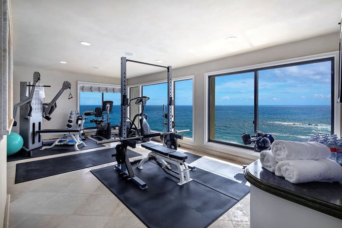 Panoramic ocean views and state-of-the-art amenities for health and fitness, including a gym, steam room, and sauna, are among the highlights of this waterfront retreat in Laguna Beach. 