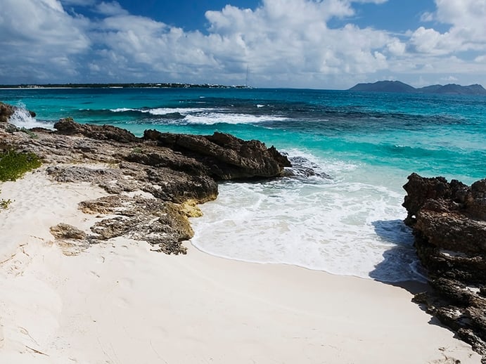 A perfect crescent shape, Rendezvous Bay beach has a rugged area at its western end. Photograph: Getty Images
