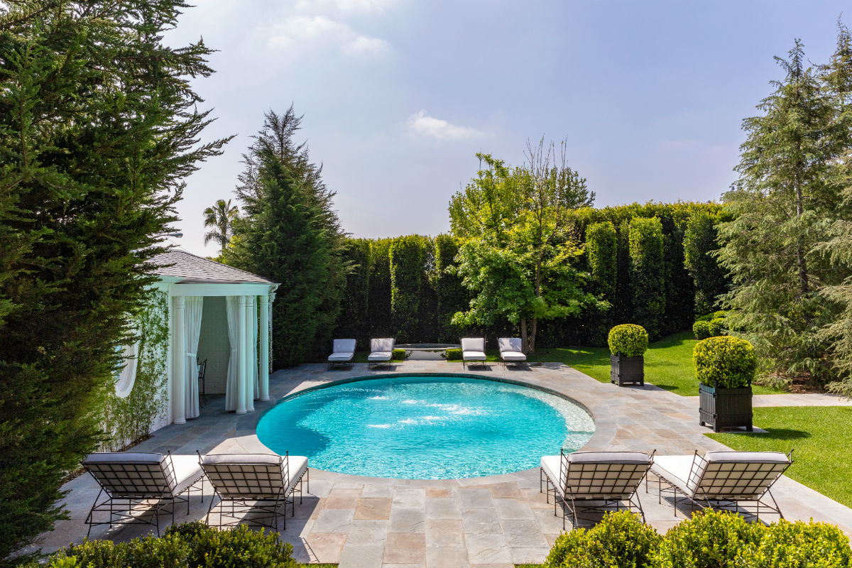 Another view of the back yard demonstrates its utility as an additional living and entertaining space.