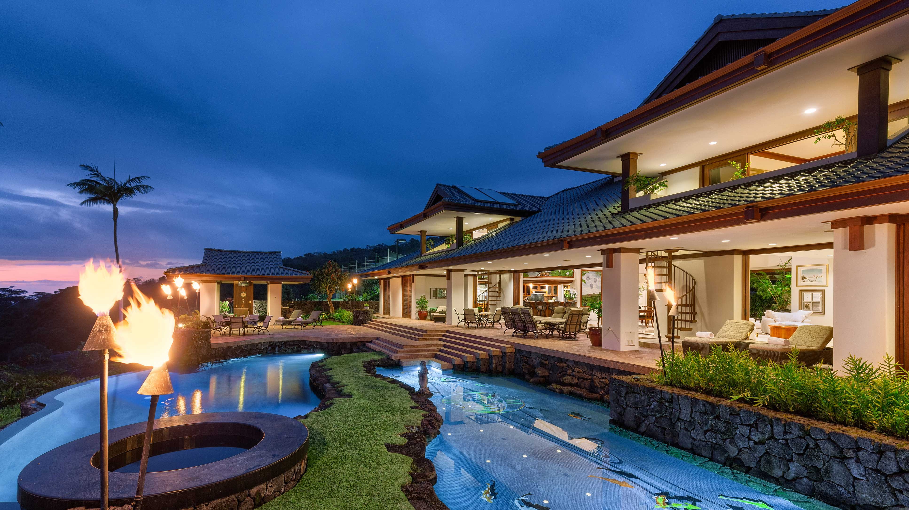 This private estate on Hawaii’s Kona Coast has an alfresco dining terrace surrounded by Japanese-inspired botanical gardens with a koi pond, waterfalls, and exotic fruit and nut trees.