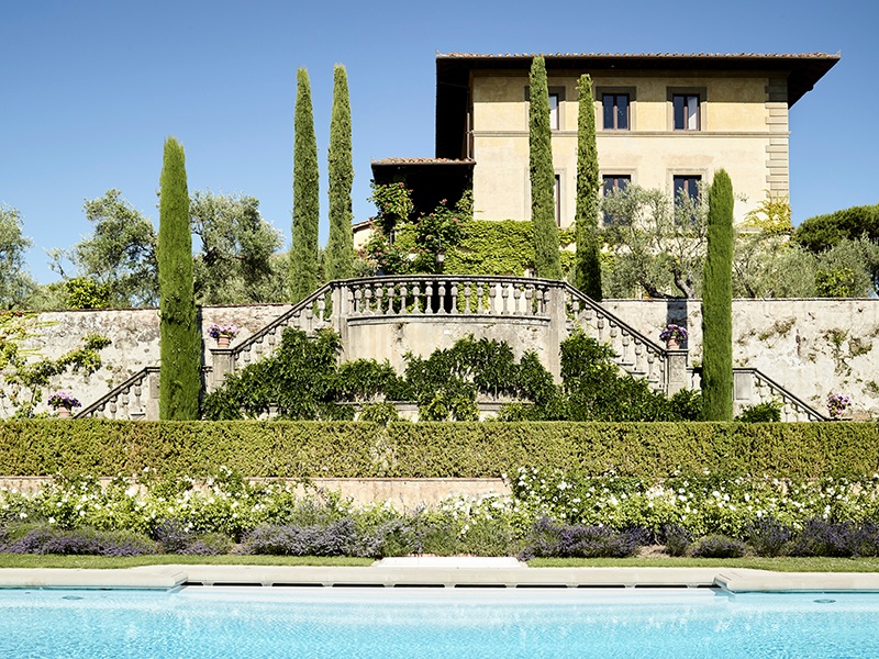 Formal Italian gardens and a swimming pool are overlooked by the main house at Il Palagio. Photograph: Fabrizio Cicconi