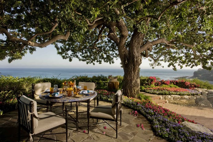 This terraced patio faces iconic Pt. Dume in the distance, and can serve as an open-air breakfast-nook.