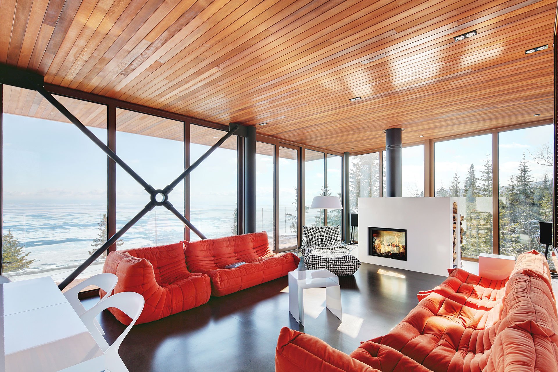 Perched on a promontory overlooking the St. Lawrence River, in Charlevoix, Quebec, this deftly designed home redefines the ski chalet for the 21st century.