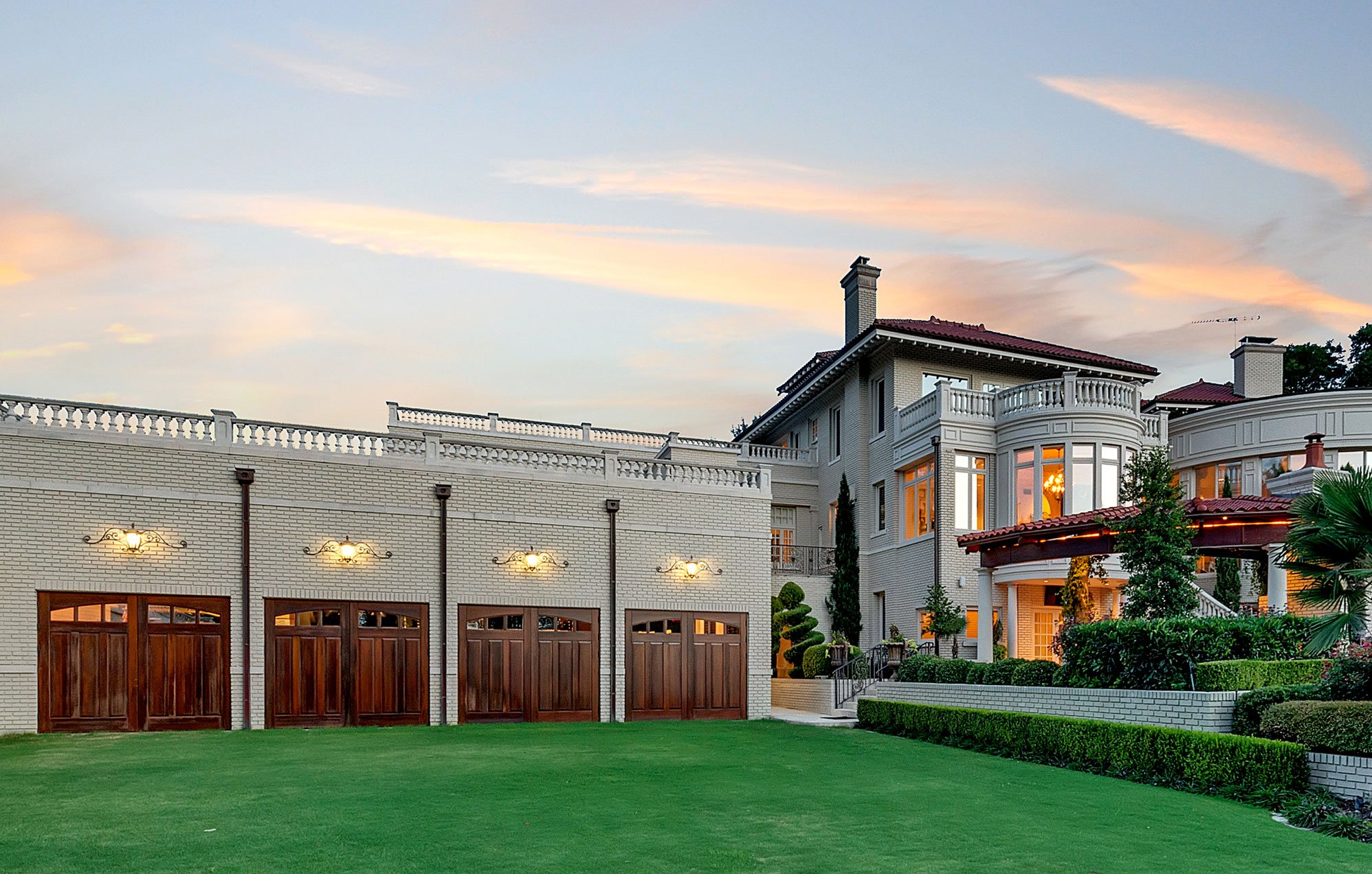 The Baldridge House, a magnificent 1.5-acre estate in Fort Worth, has a multi-vehicle garage facility with a car lift, workshop, and wash bay.
