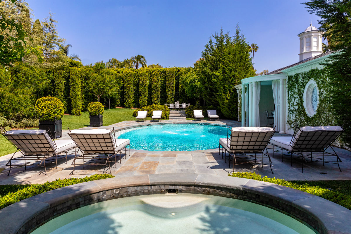 The very private back yard features a pool, spa, and cabana.