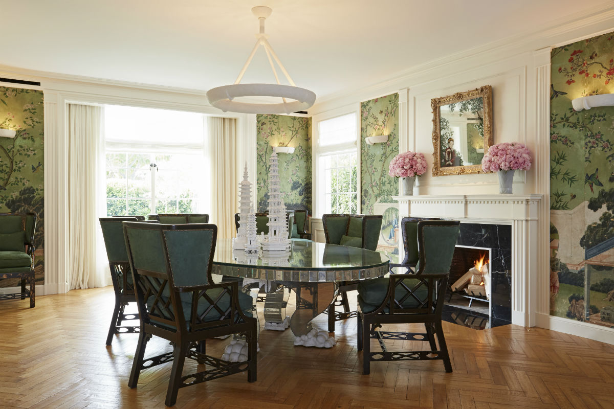 The breakfast room is elegantly decorated with antique wallpaper and is ideal for informal meals.