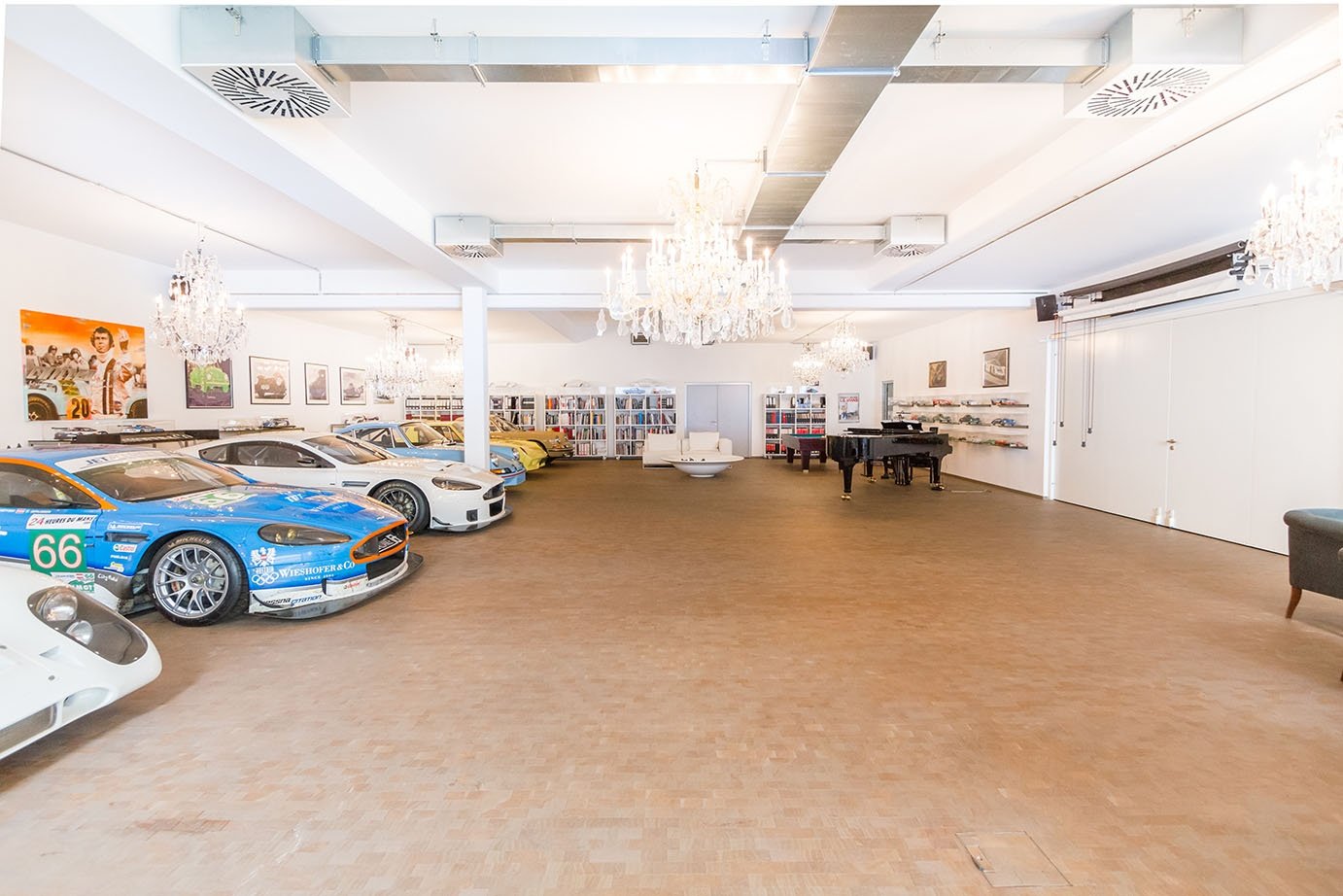 This Vienna estate has a trove of luxurious amenities, including an underground, eight-car showroom complete with crystal chandeliers, a grand piano, and an adjoining workshop with lifting ramp.